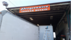 The PROGRESSIVE TRAILER REPAIR & TOWING service vehicle A photo of the PROGRESSIVE TRAILER REPAIR & TOWING service truck